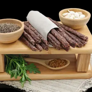 Traditional beef droëwors spiced with garlic hanging in The Village Butcher.