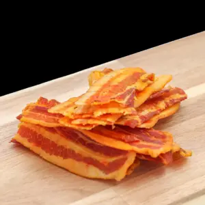 Strips of cured bacon biltong glazed with honey and pineapple at The Village Butcher, Hauraki.